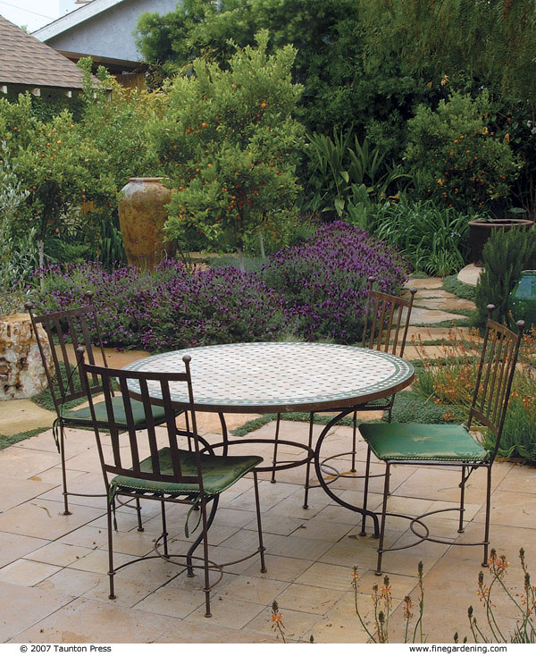 limestone patio with table and chairs