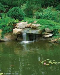 Small waterfall over water garden